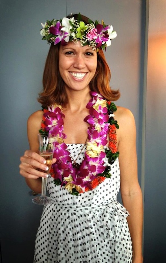 A photo of me the day that I graduated with my PhD. It’s a Hawaiian tradition to pile leis on the graduate.