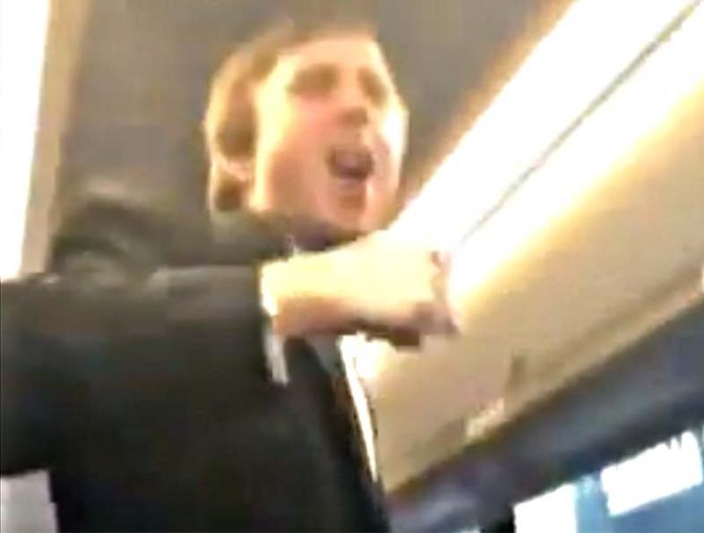 Tuxedo-clad member of Sigma Alpha Epsilon fraternity at University of Oklahoma leads a bus full of partygoers on a racist chant Saturday night.  / ((The Unheard Movement via YouTube)) 