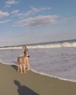 rockaway beach women at edge of ocean