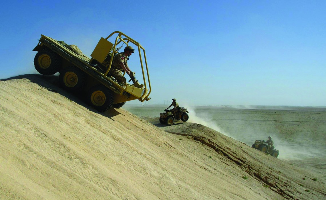 Soldiers from the 1st Battalion The Parachute Regiment practise driving all terrain vehicles in the Kuwaiti desert.