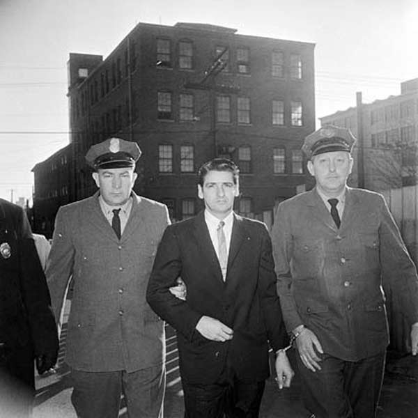 Albert DeSalvo, AKA "The Boston Strangler," being escorted by police. (Wikimedia Commons)