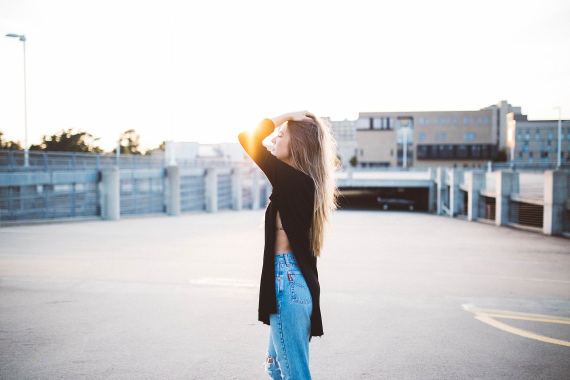 girl brushing fingers through hair