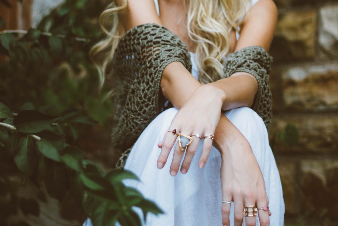 Blonde woman with shawl and white dress