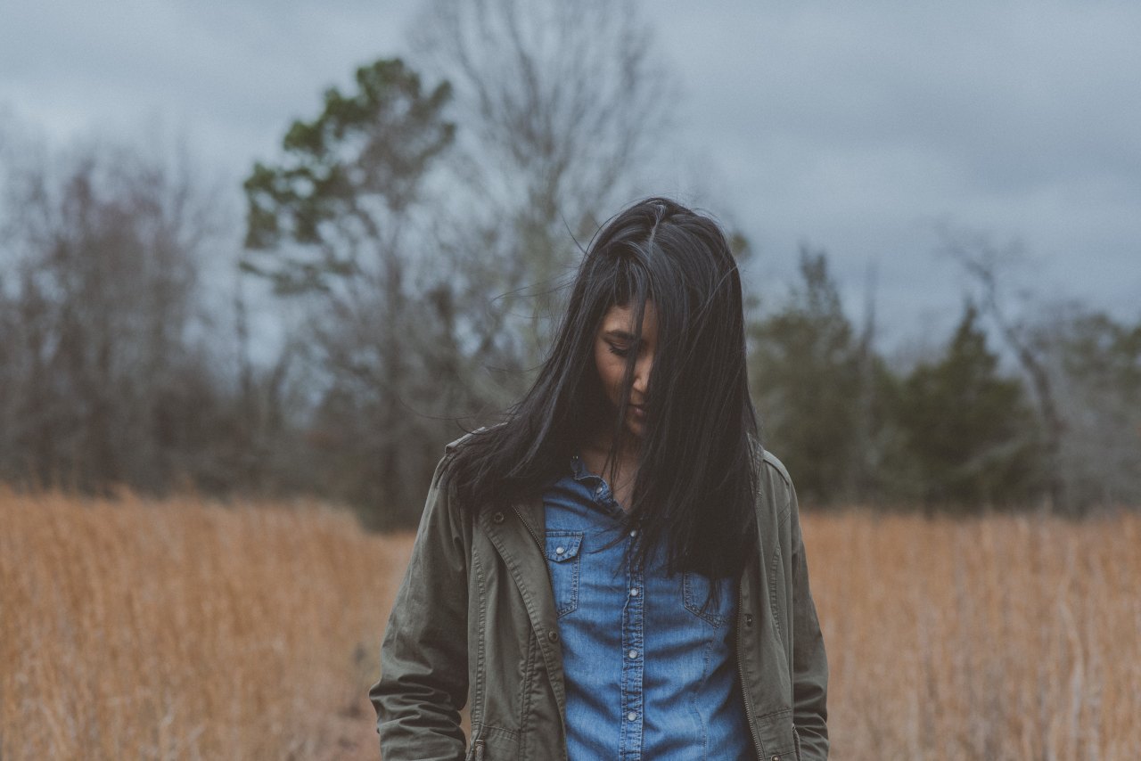 Woman walking through woods