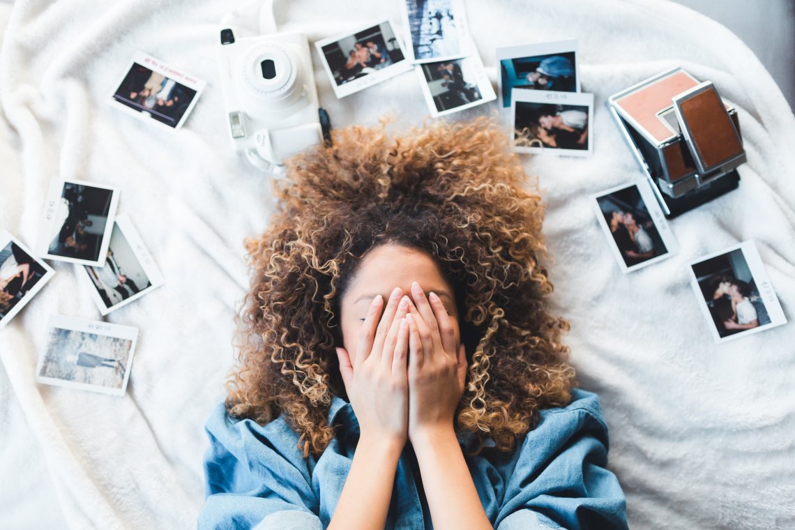 girl with hands covering face