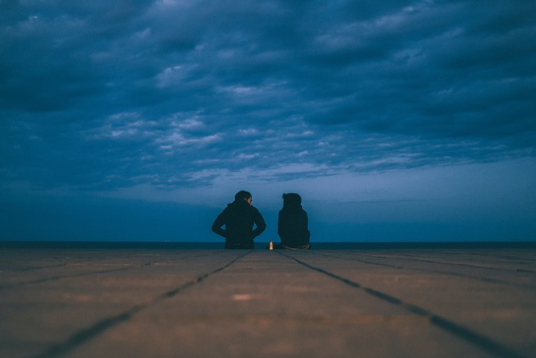 Couple Talking on rooftop in the cold