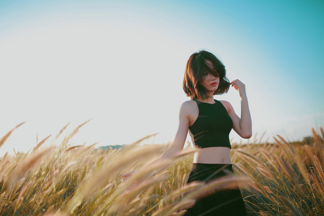 Woman standing in golden field