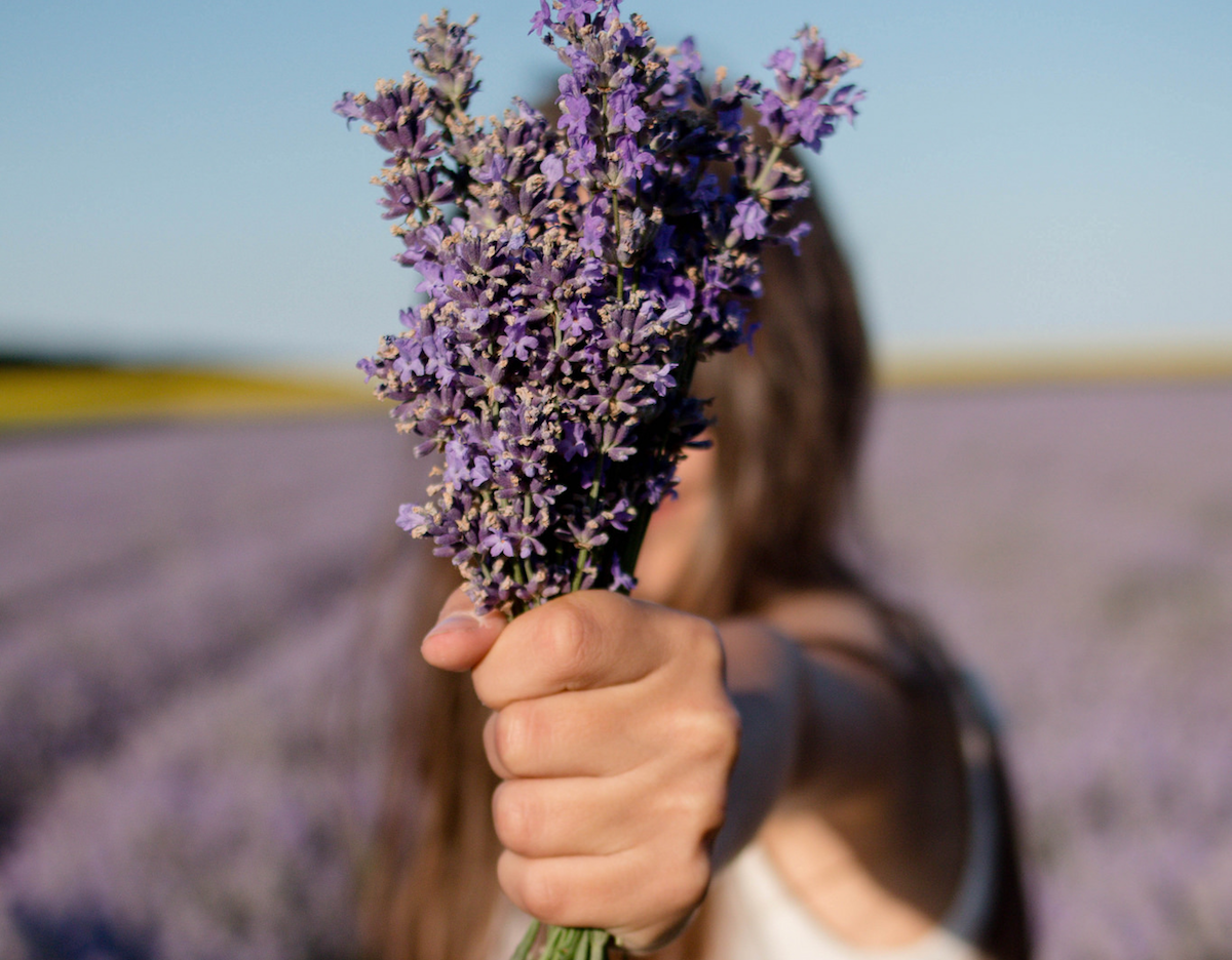 Resilient girl holds flowers