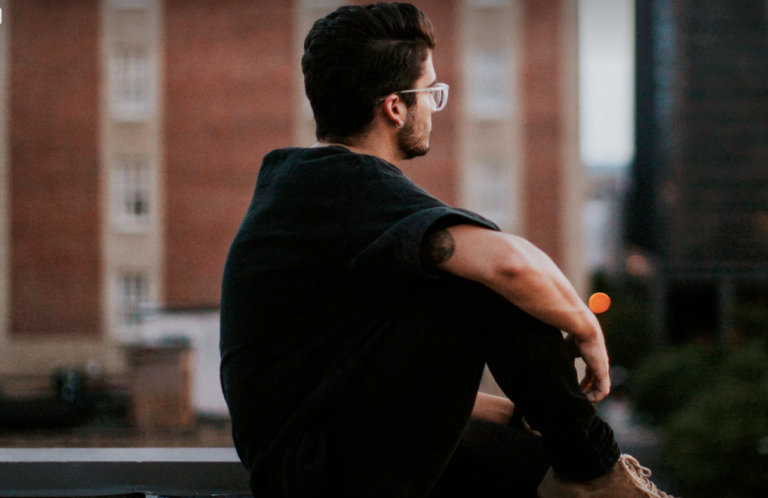 Guy sitting on roof