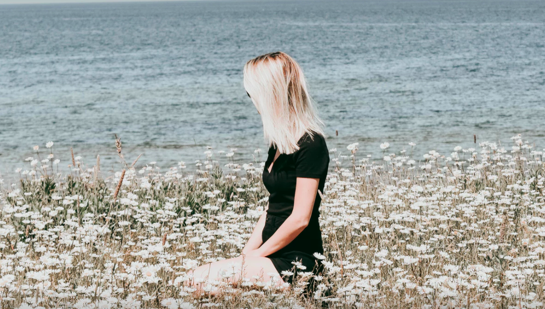 Woman in field of flowers