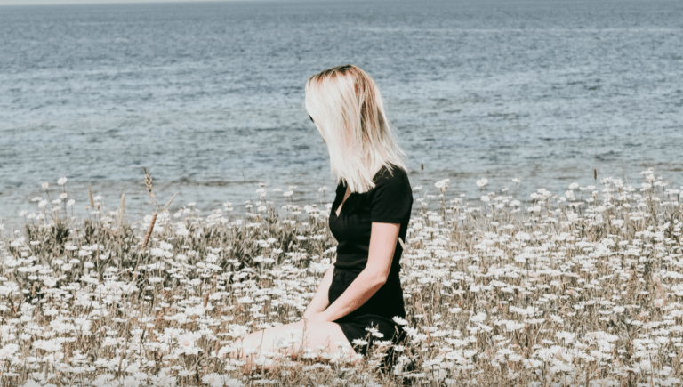 Woman in field of flowers