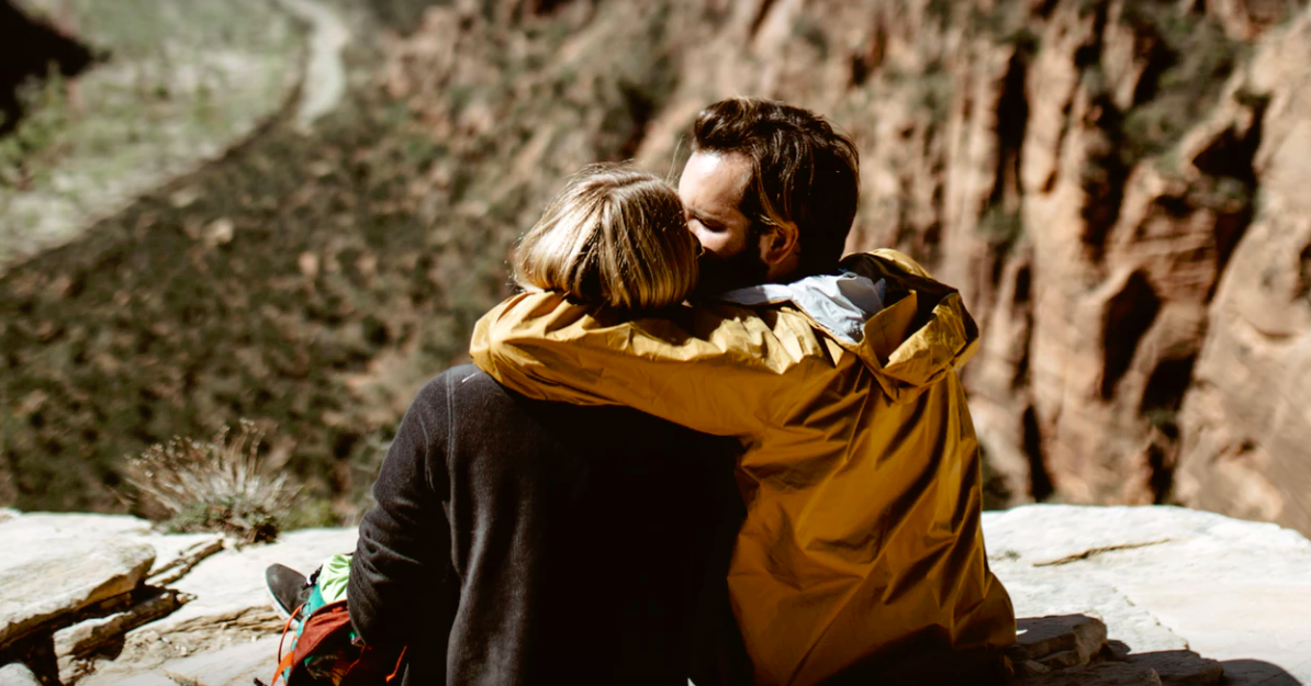 Couple kissing on a hike