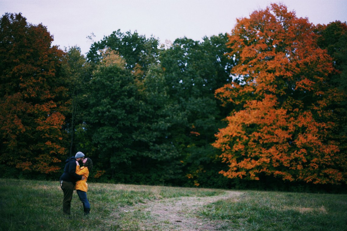 Couple kisses in the autumn air