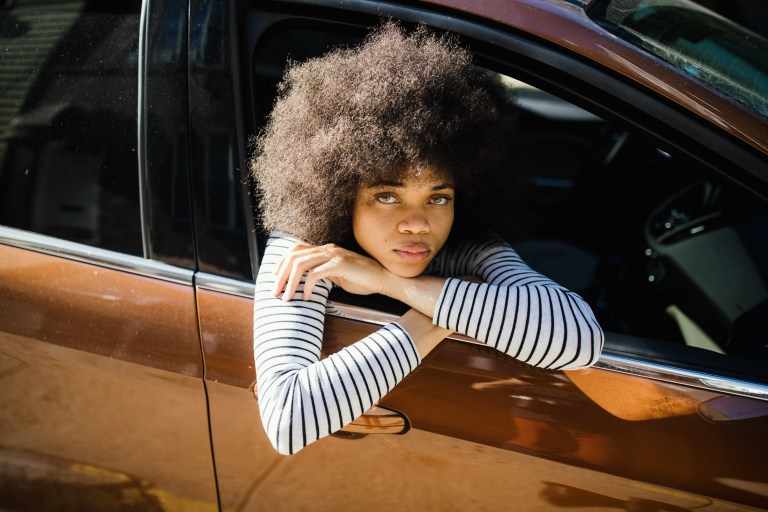 Girl looking out car window