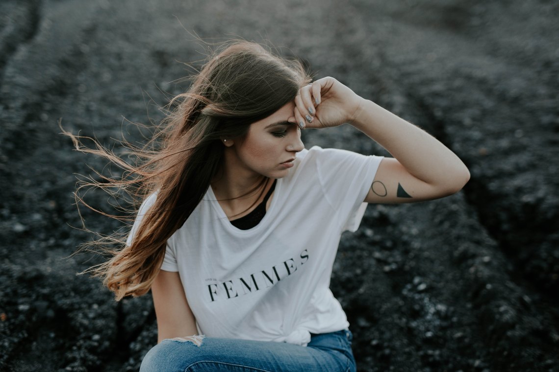 woman sitting in field