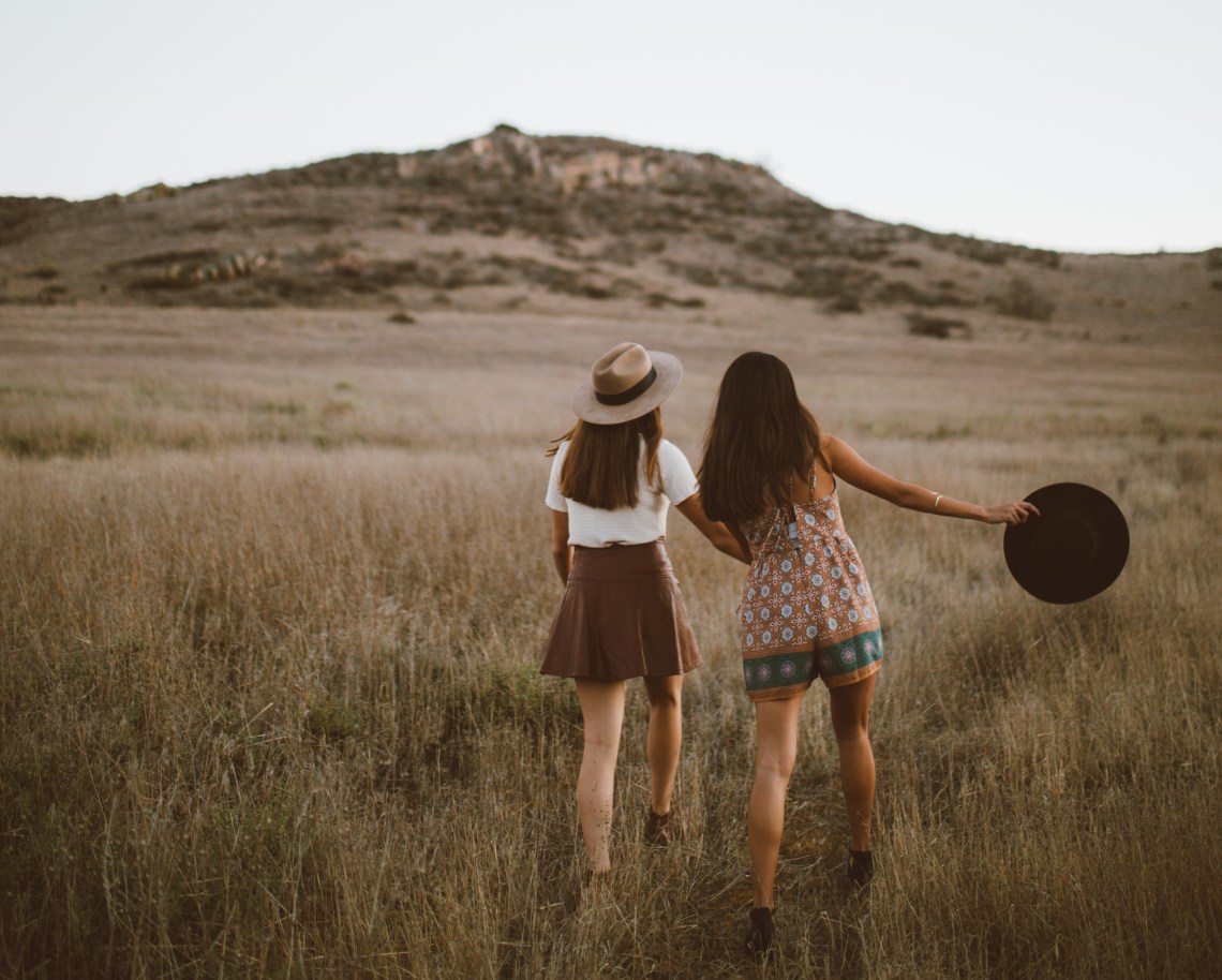 girls running in a field, dancing girls, country music, best love songs, best love songs in country music