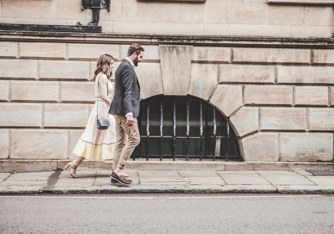 Couple walking down street