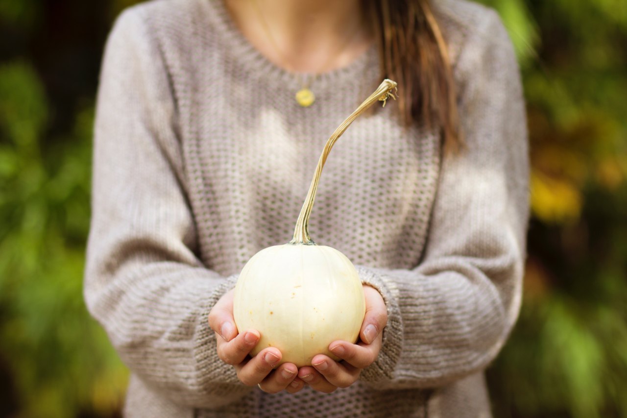 Girl holding pumpkin