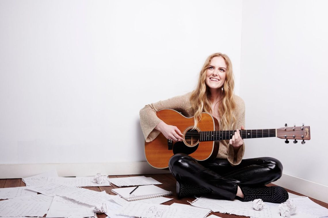 Megan Davies with guitar, Black And White, you are multicolored