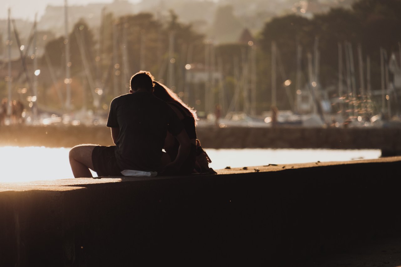 couple sitting on ledge