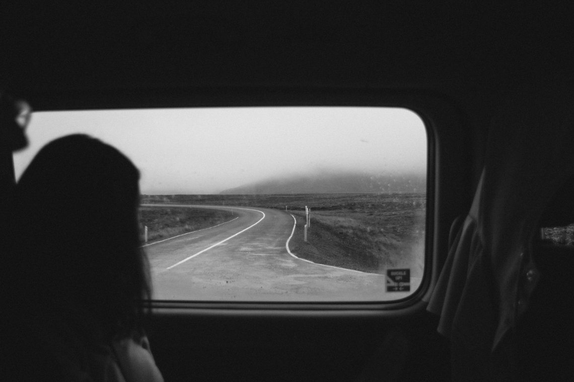 woman staring out window