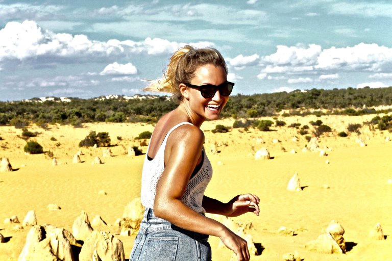 happy woman smiling in sunglasses