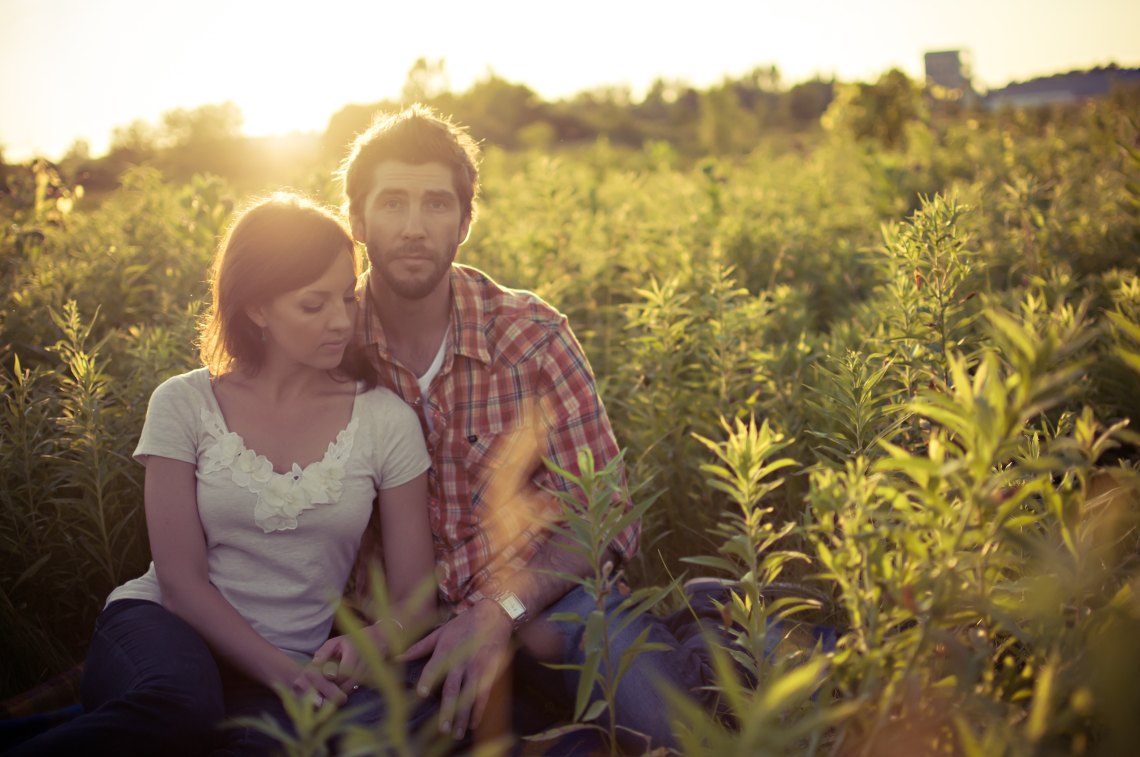 couple sitting in field