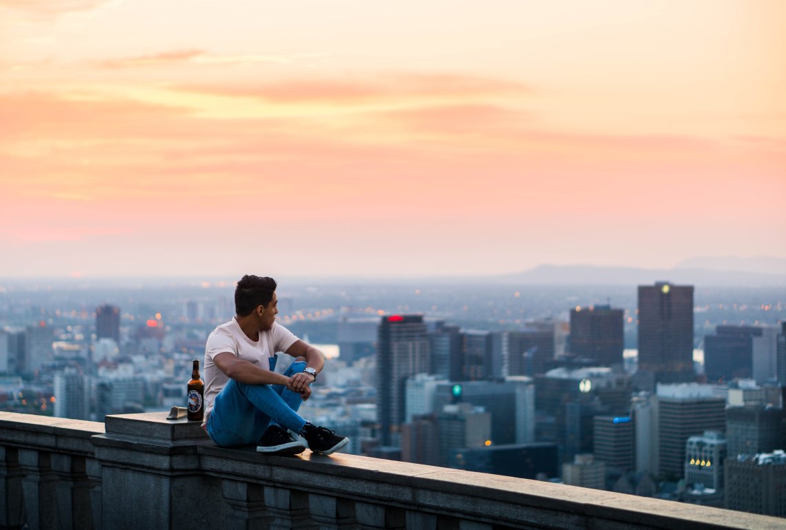 guy looking over city at sunset, endings, painful endings