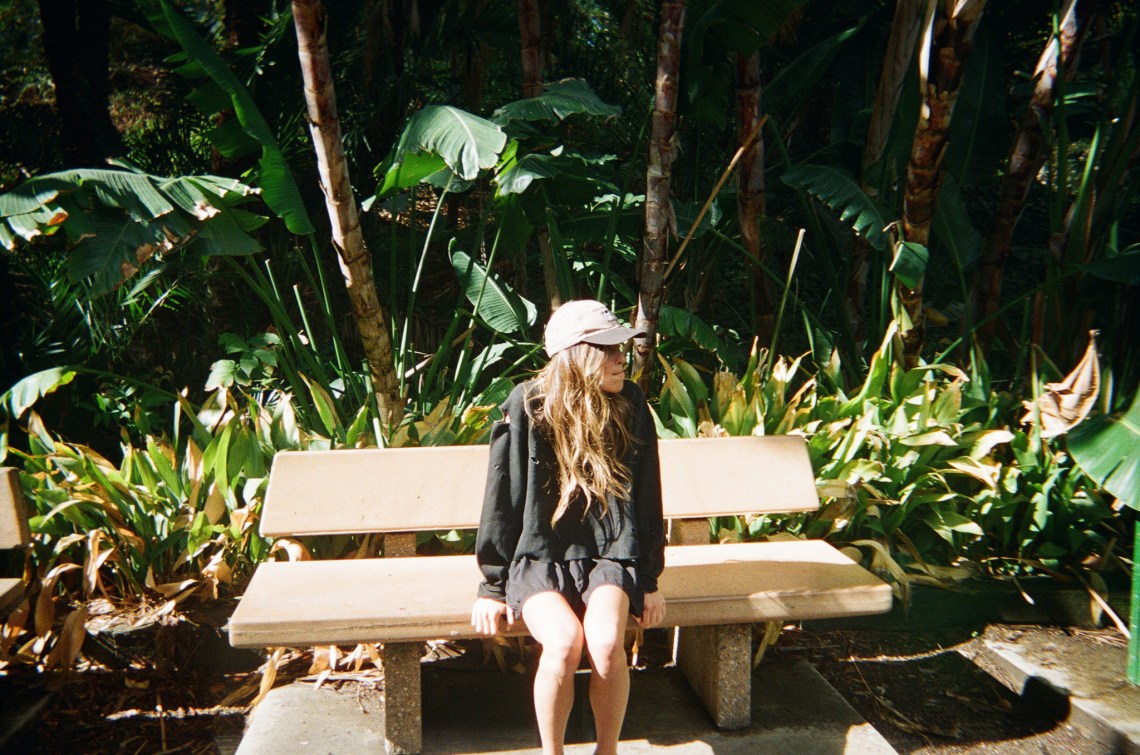 girl sitting on a park bench, signs of strength, leaving a narcissistic relationship