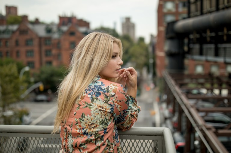 girl on balcony looking away