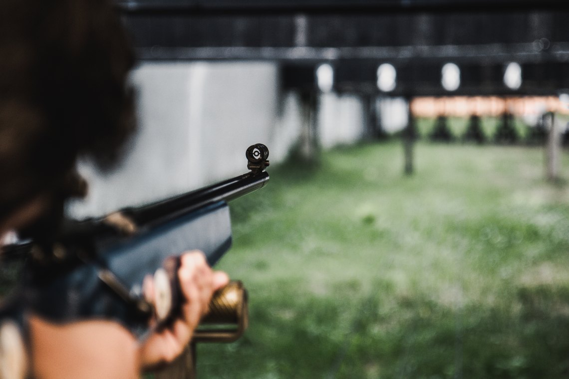 someone shooting a rifle at a shooting range