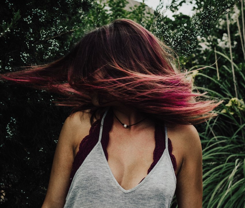 girl with spinning hair, happy woman, feminism, feminist poetry