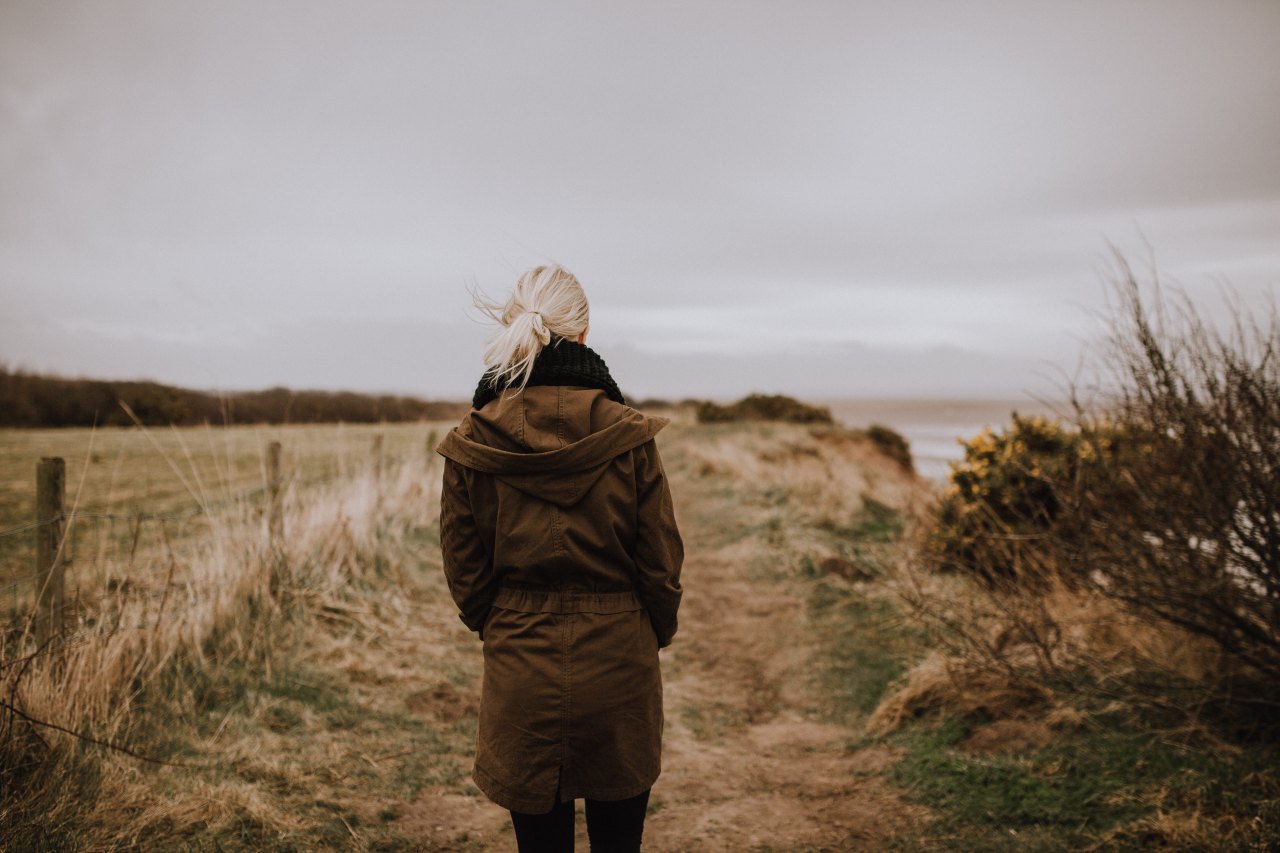 feeling depressed, girl looking at field, depression, I will be okay