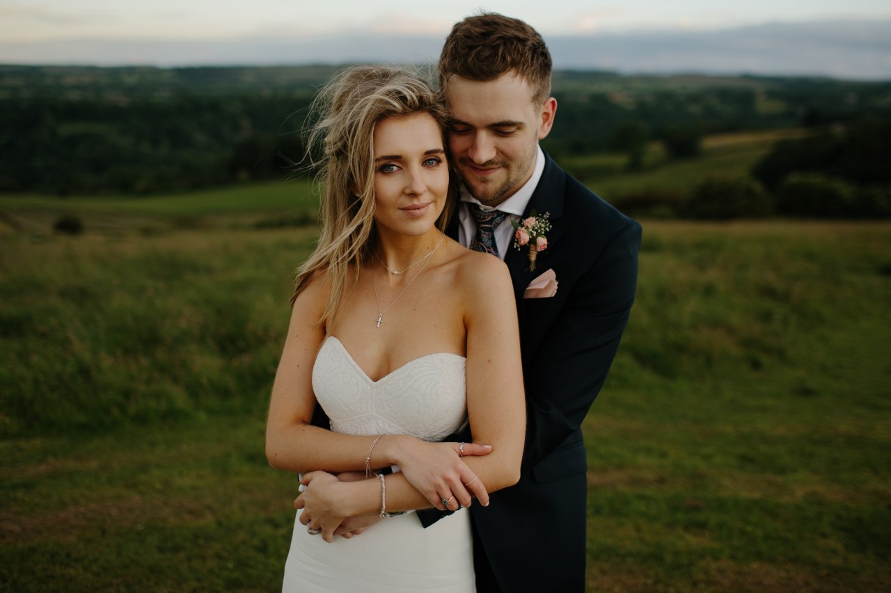 Bride and groom hugging