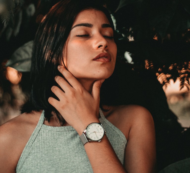 girl with hand on her neck, girl filled with uncertainty, unsure, feeling uncertain, change of seasons