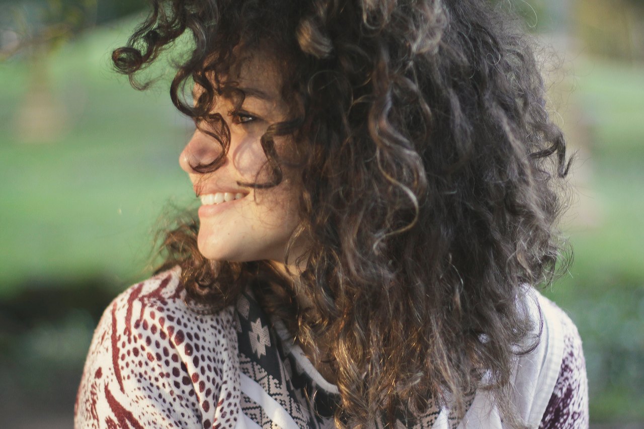 Woman smiling to side