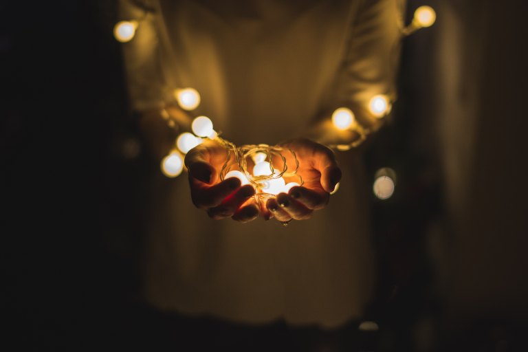 girl holding lights, little things, being thankful