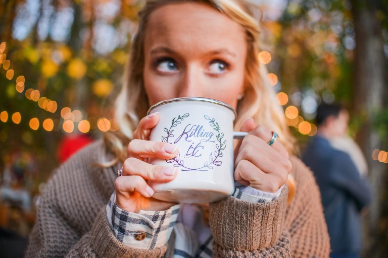 girl drinking out of killing it mug