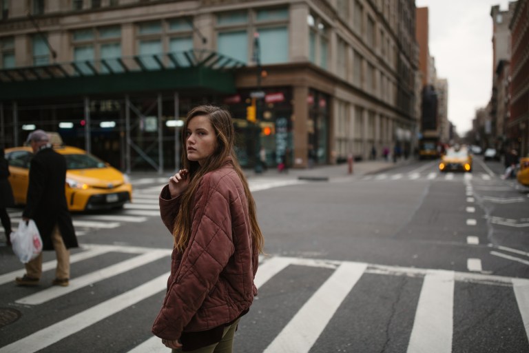 woman sad on crosswalk