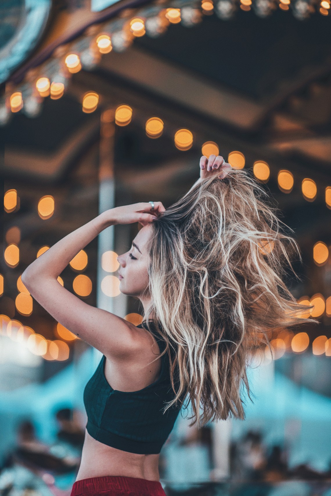 woman standing in front of merrygoround