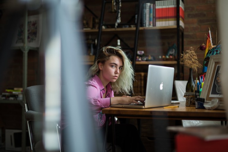 glaring girl on laptop