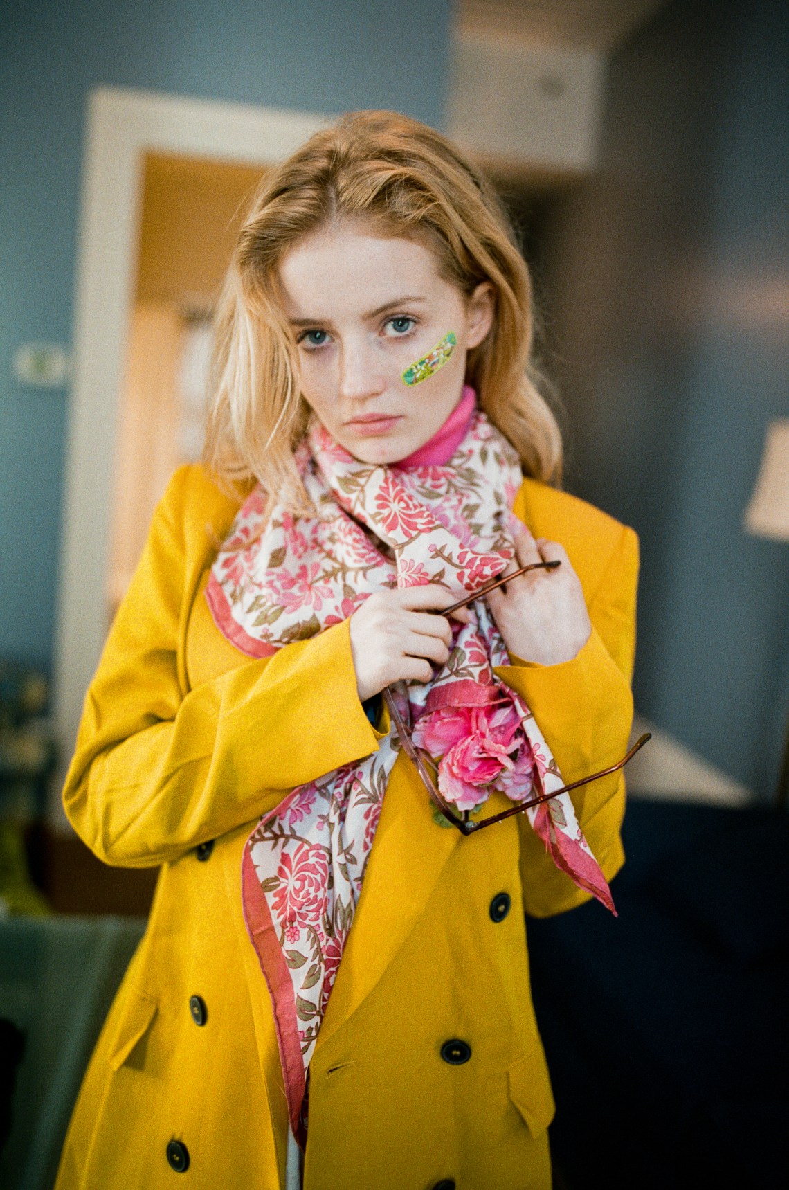 woman adjusting scarf