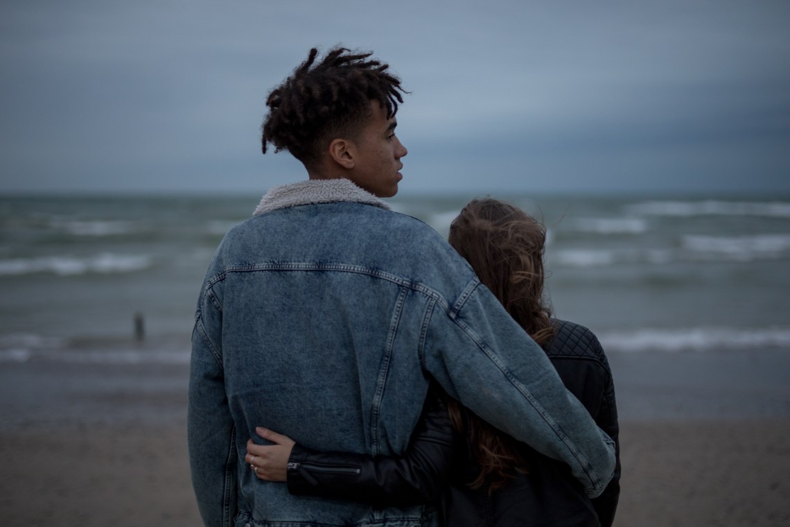 couple standing on beach