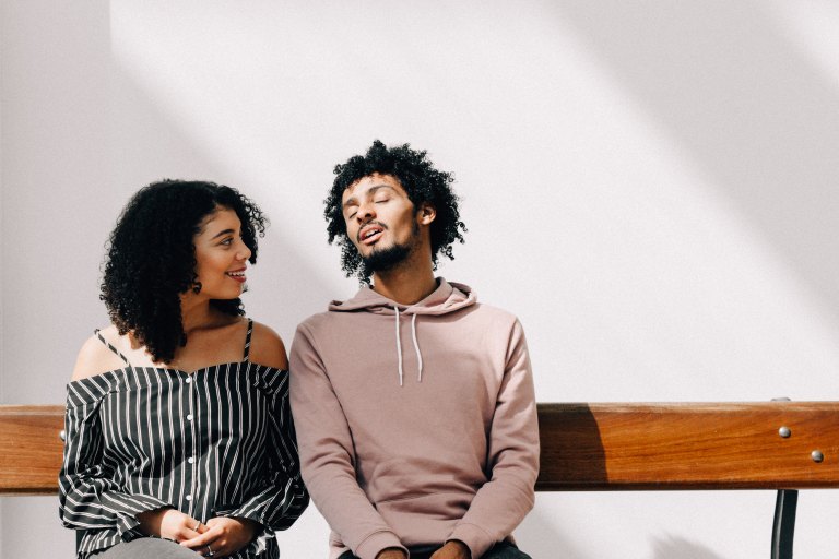 couple sitting on bench