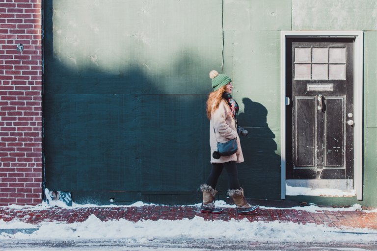 girl walking through the snow