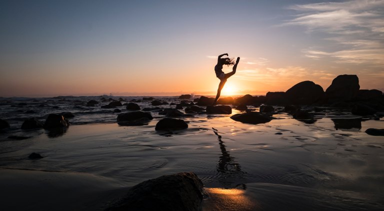 girl dancing on the beach