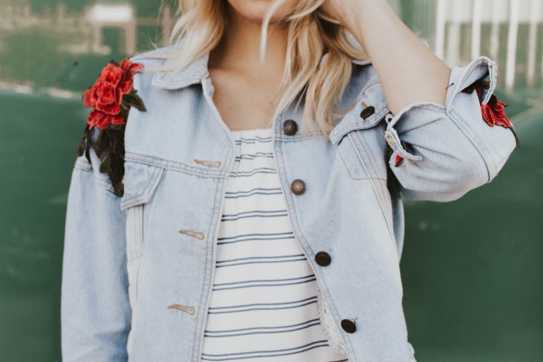 woman standing in jean jacket