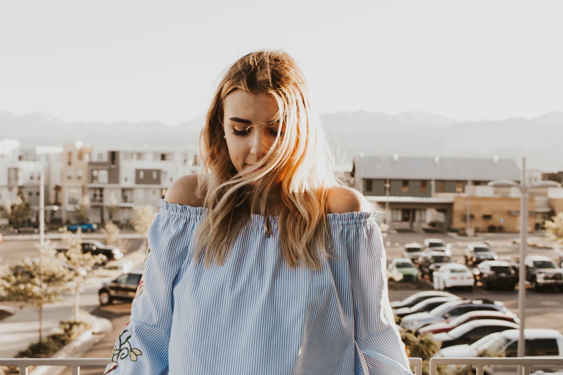 girl standing in sunshine