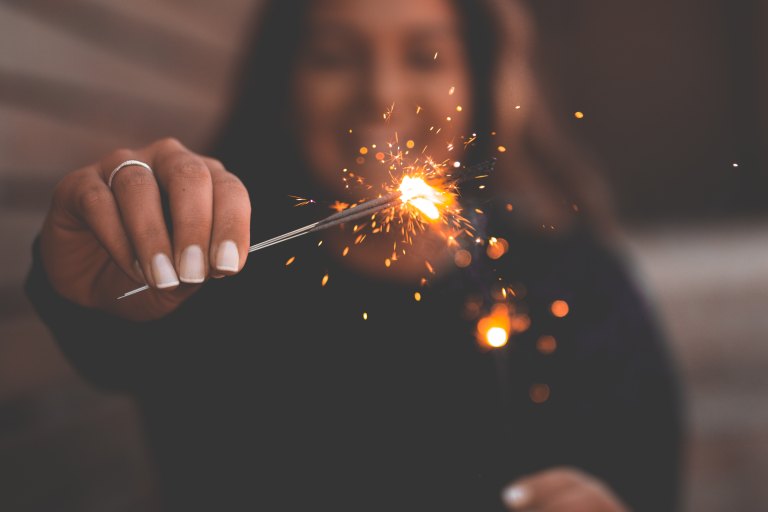 woman holding sparkler