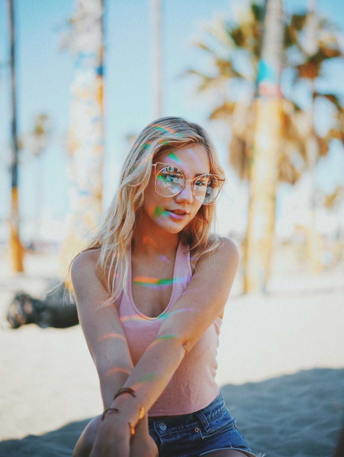 girl in glasses with rainbows on her